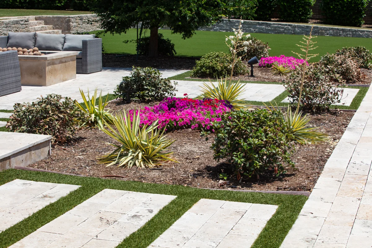 An installation of artificial turf and artificial grass in an backyard in Peachtree Hills
