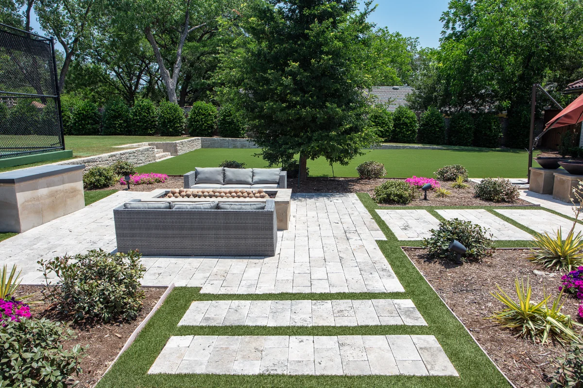 An installation of artificial turf and artificial grass in an backyard in Johns Creek
