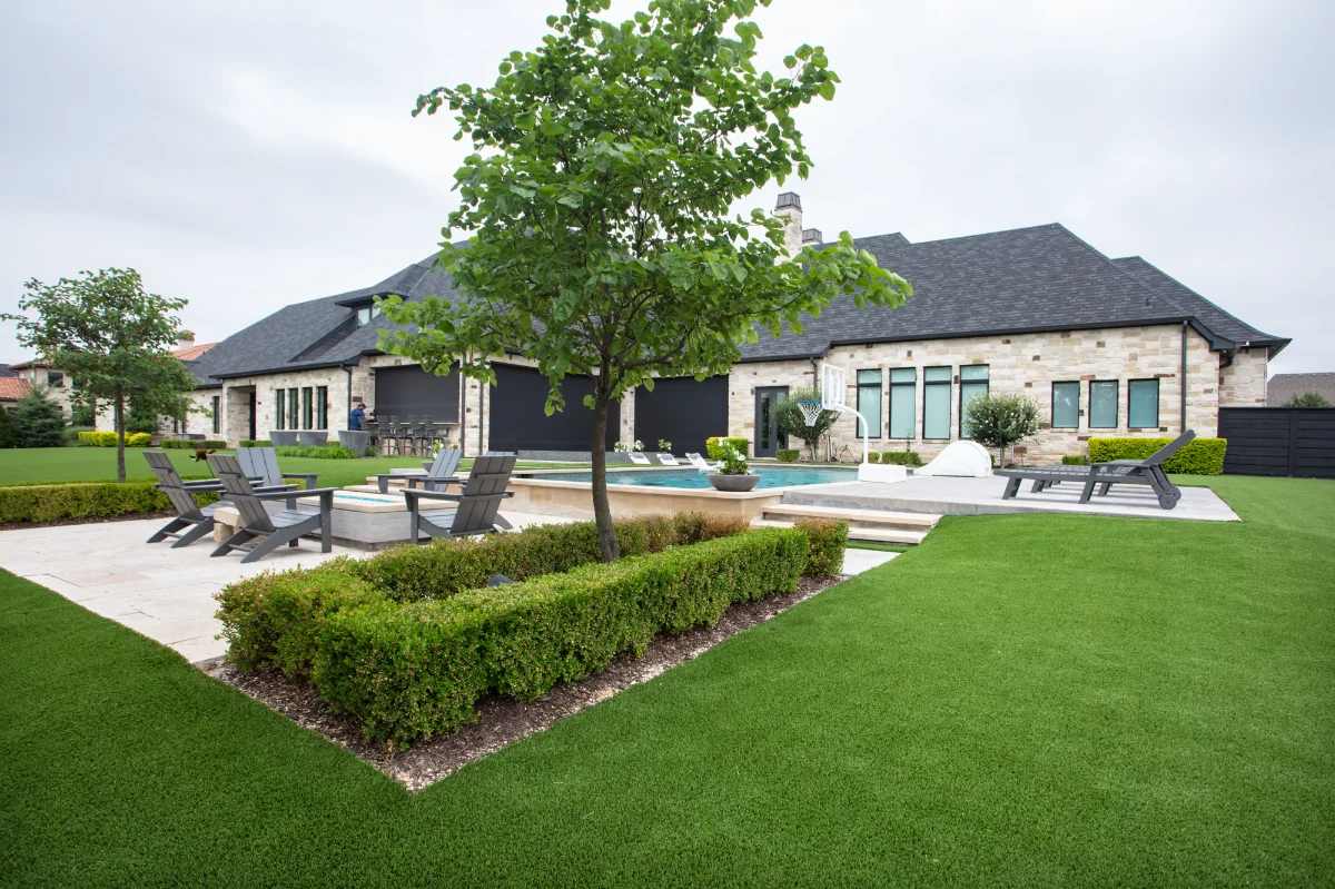 Artificial Turf Lawn in Atlanta Artificial Turf Lawn in Atlanta with a fire pit patio and landscaping