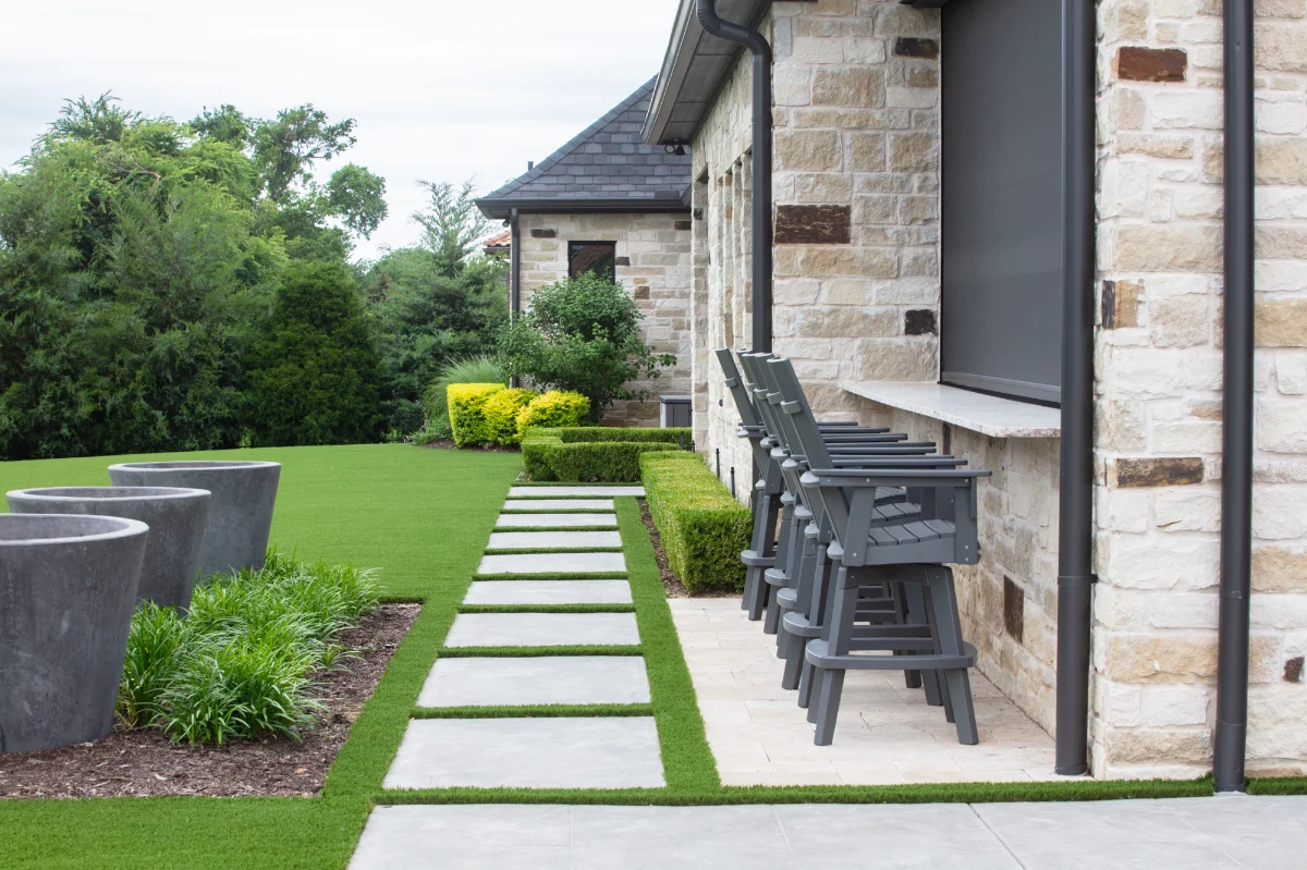An installation of artificial turf and artificial grass in an backyard in Bee Cave