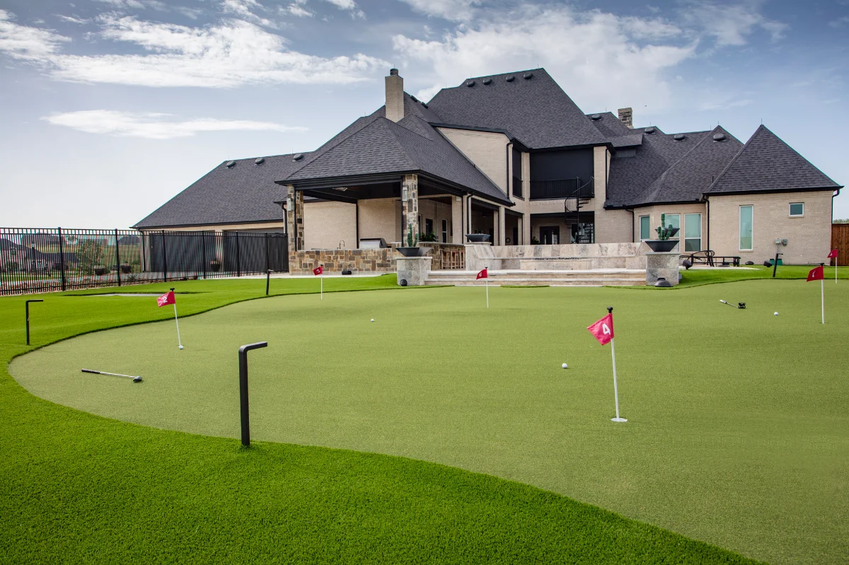 Artificial Putting Green with 9 holes and lighting in a residential backyard