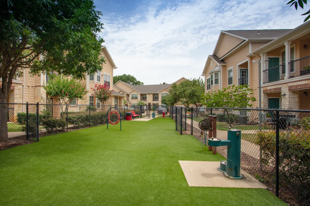 Artificial Turf Dog Park with play equipment and water fountains