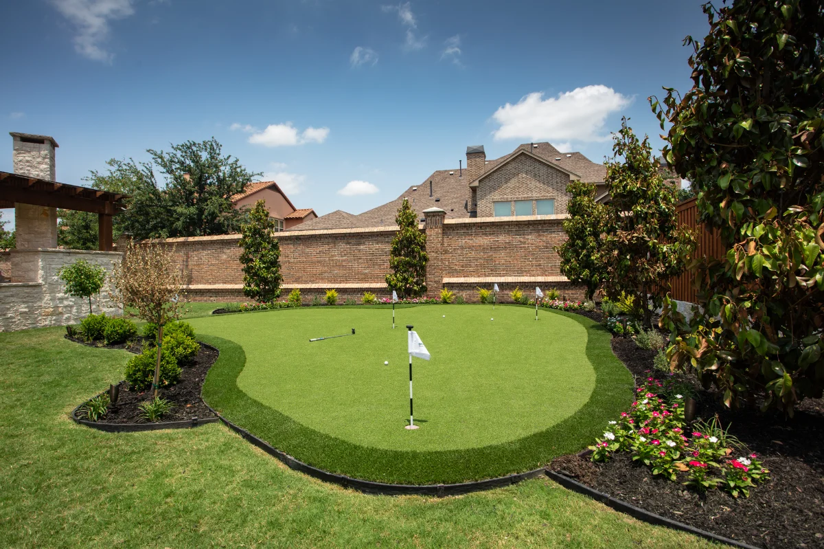 Putting Green in Tampa with landscaping in a residential backyard