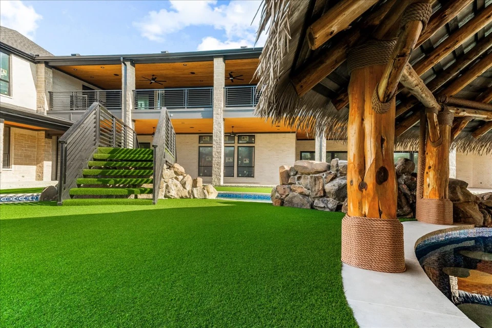 Synthetic Turf Lawn in Atlanta Synthetic Turf Lawn in Atlanta with a swim up bar and bridge