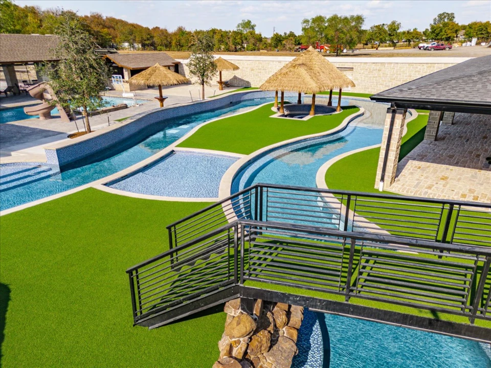 Synthetic Grass Yard Synthetic Grass Yard with a lazy river and bridge