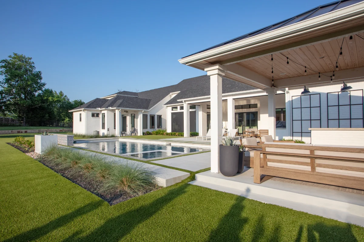 Artificial Grass Lawn Artificial Grass Lawn in a residential backyard with a pool and a pergola