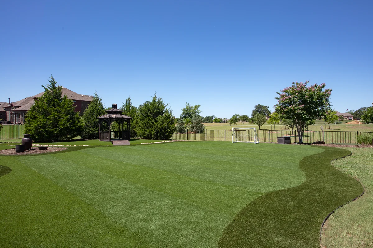 An installation of artificial turf and artificial grass in an backyard in Bellaire