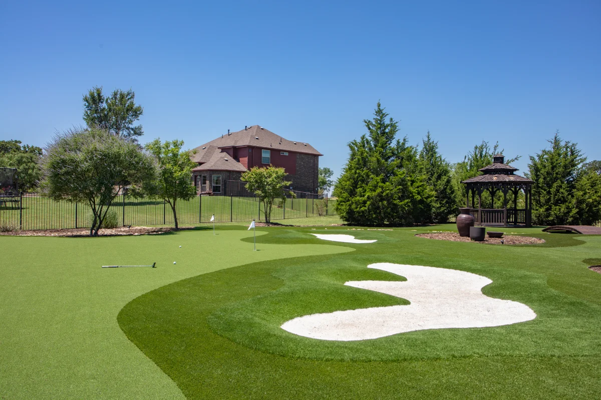 Artificial Backyard Putting Green With Bunkers and landscaping