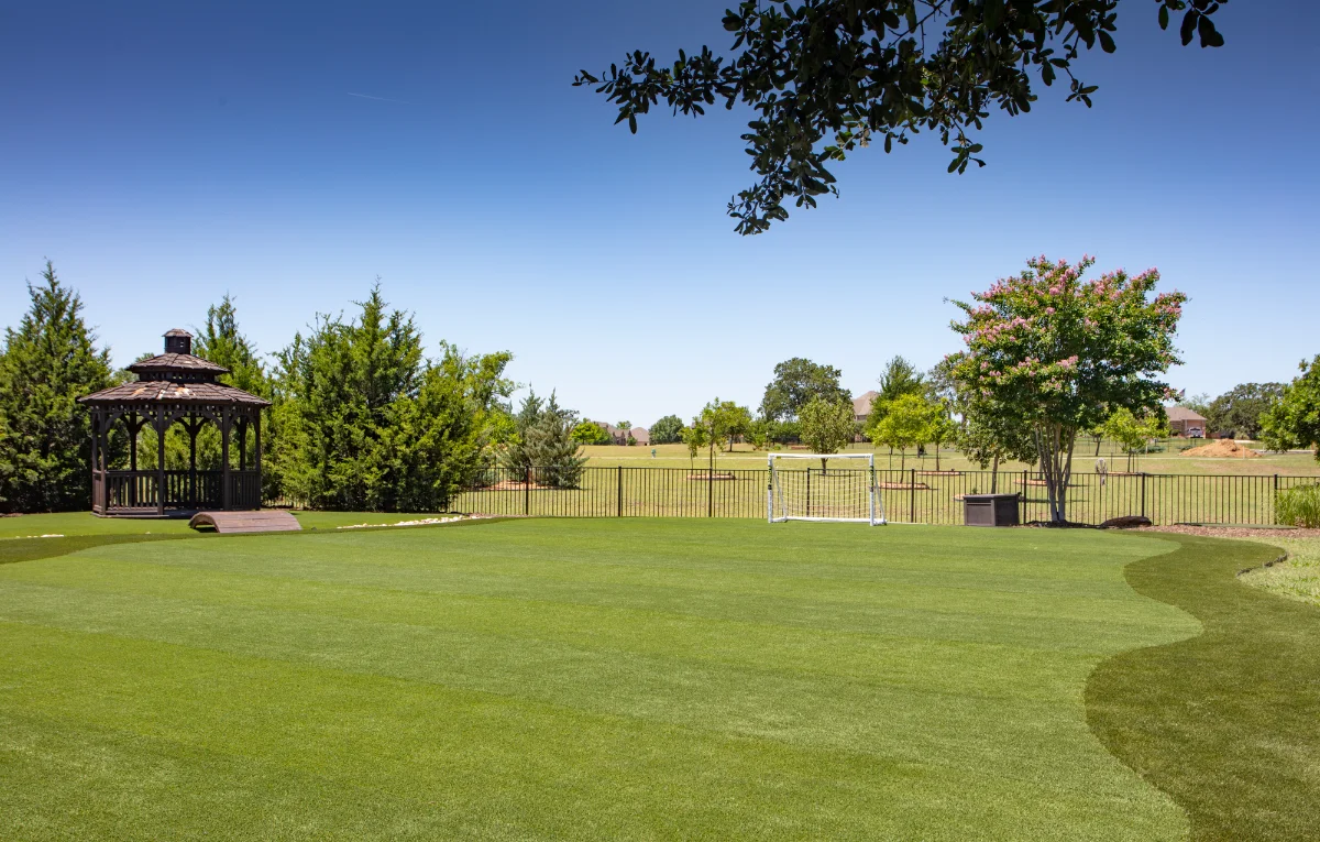An installation of artificial turf and artificial grass in an backyard in Memorial