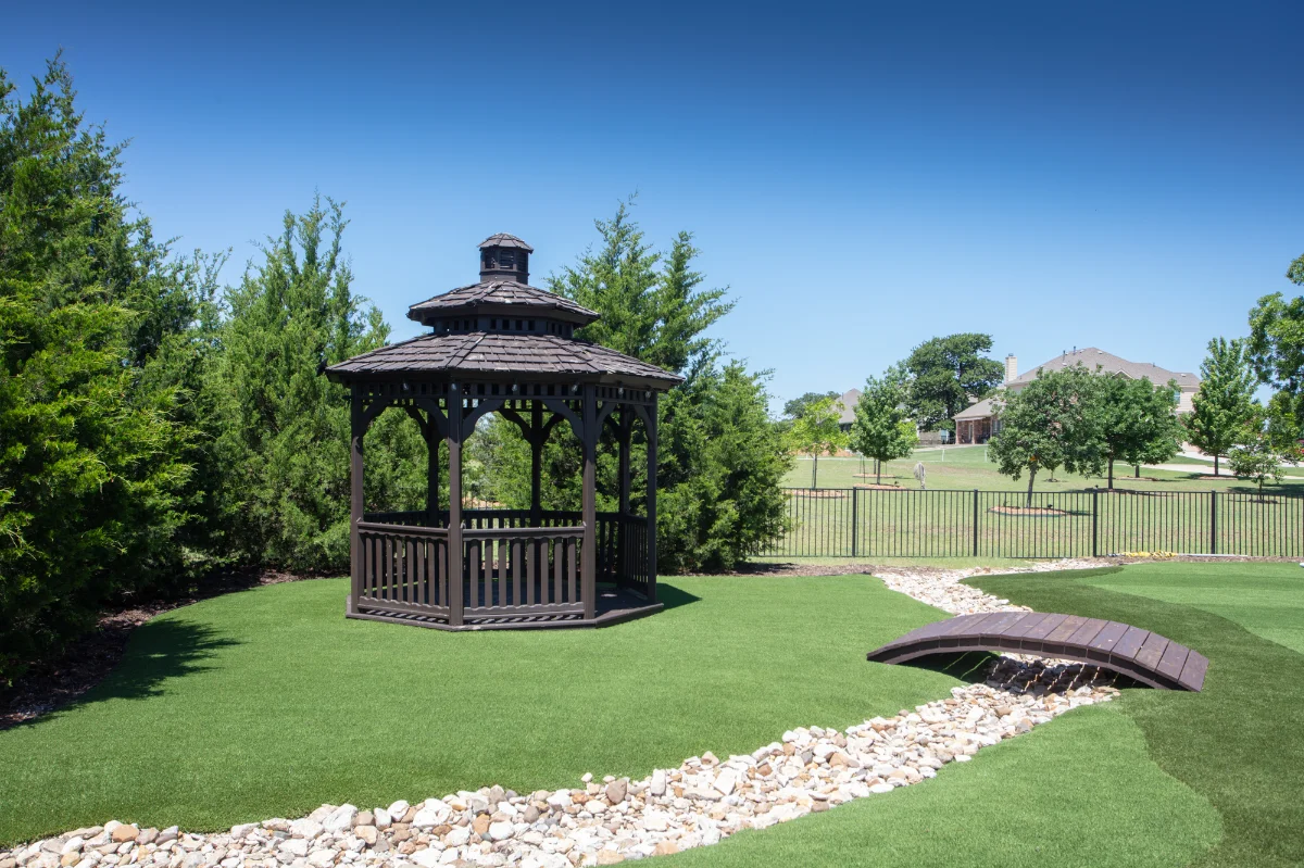 An installation of artificial turf and artificial grass in an backyard in Spring