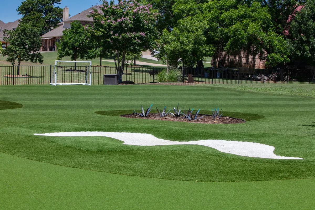 An installation of artificial turf and artificial grass in an backyard in Garden Oaks