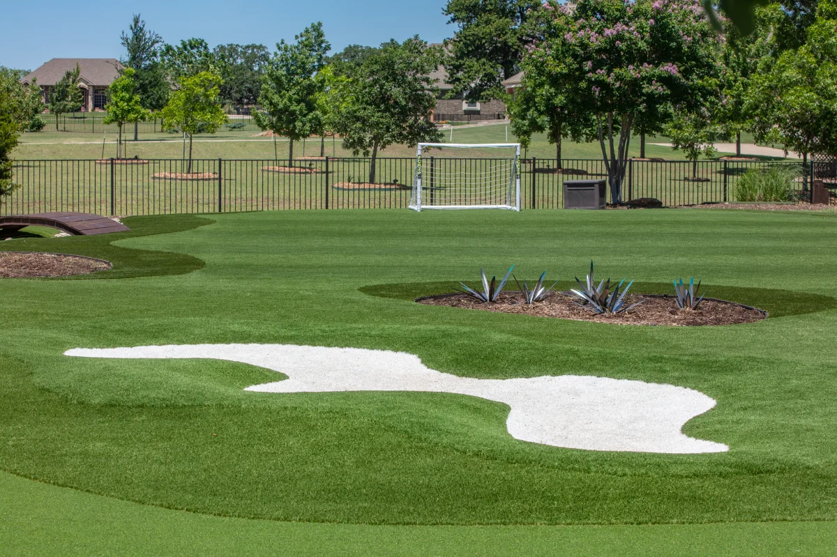 An installation of artificial turf and artificial grass in an backyard in Katy