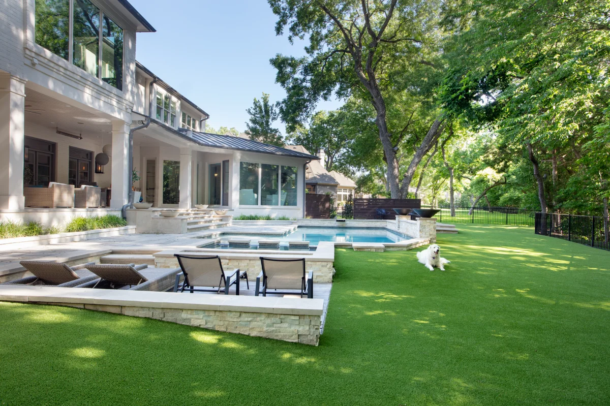 Artificial Turf Lawn in San Antonio Artificial Turf Lawn in San Antonio with a dog laying next to the pool