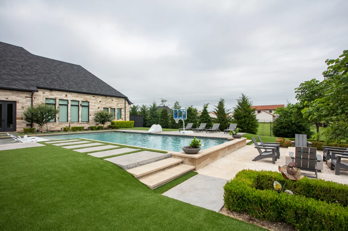 Artificial turf lawn in Charlotte with a pool